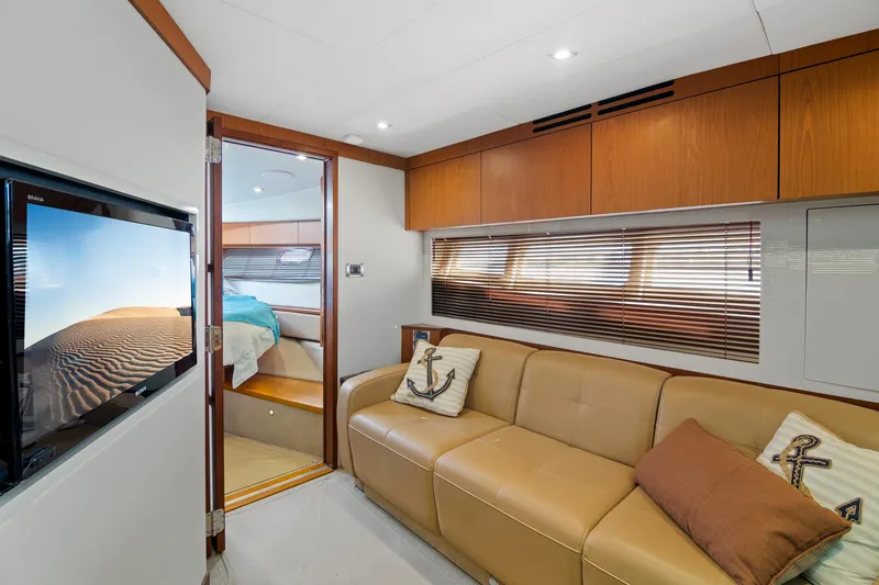 Slide: The Image of Luxurious interior of 2013 Sea Ray 410 Sundancer yacht with leather seating and modern decor. - 18