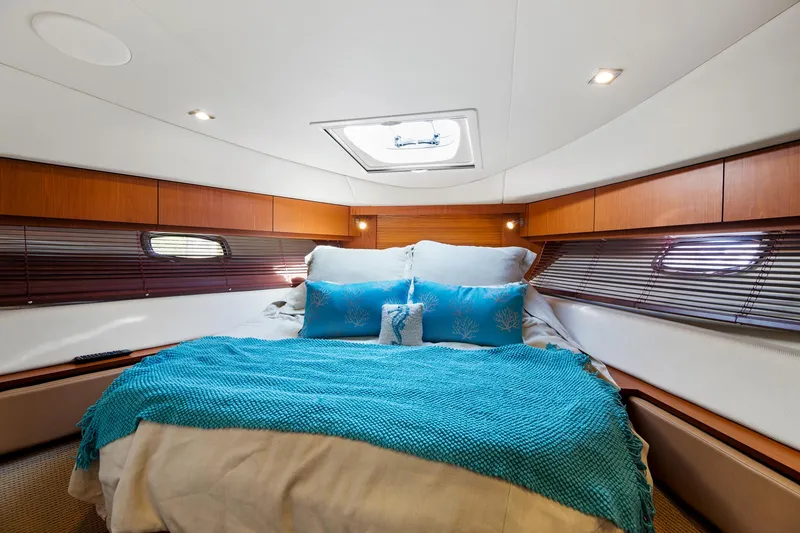 Slide: The Image of Luxurious cabin interior of 2013 Sea Ray 410 Sundancer yacht with cozy bedding. - 20