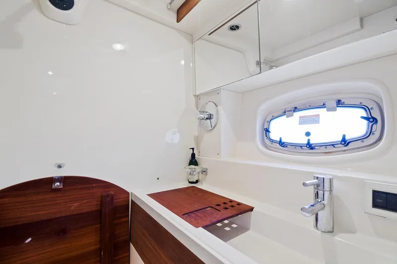 Slide: The Image of Luxurious bathroom interior of 2013 Sea Ray 410 Sundancer yacht with modern fixtures. - 21