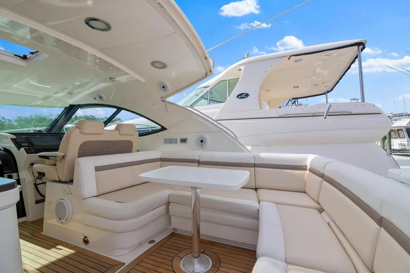 Slide: The Image of Luxurious 2013 Sea Ray 410 Sundancer yacht interior with plush seating and sleek design. - 29