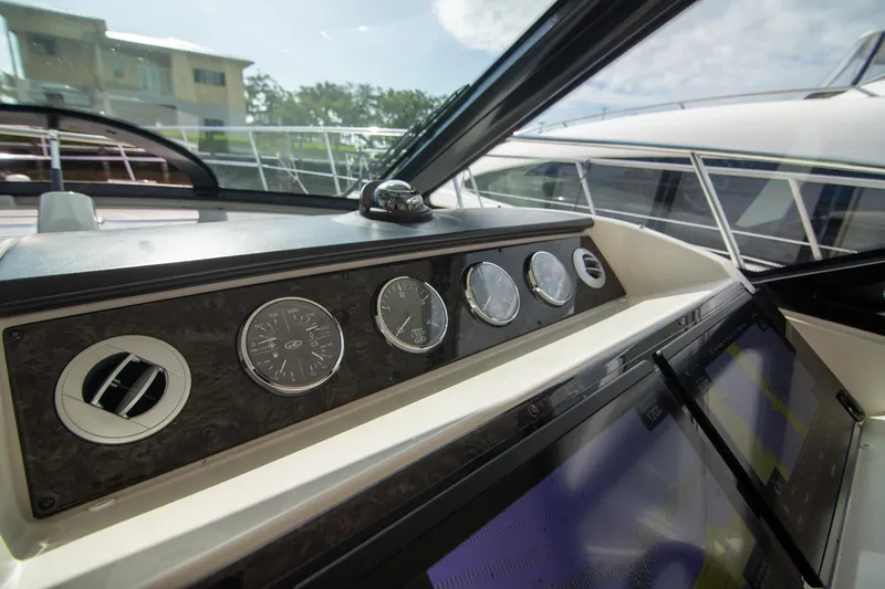 Slide: The Image of Dashboard of 2013 Sea Ray 410 Sundancer yacht with gauges and controls. - 33