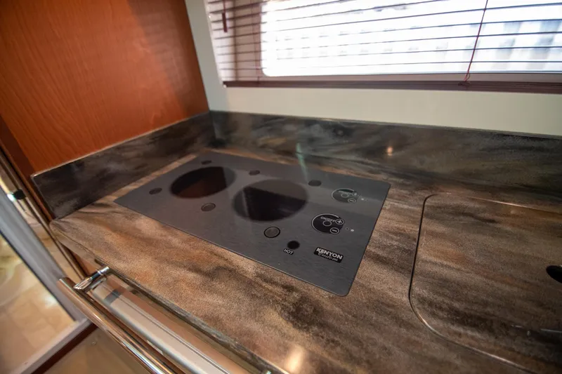 Slide: The Image of Modern kitchen countertop with induction cooktop on 2013 Sea Ray 410 Sundancer yacht. - 46