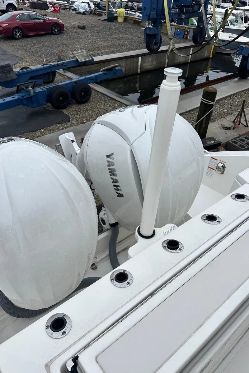 Slide: The Image of 2024 Pursuit S 328 Sport boat with Yamaha engines at a marina. - 14