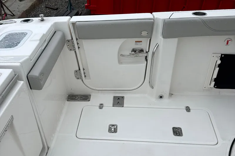 Slide: The Image of 2024 Pursuit S 328 Sport boat interior with sleek white and gray design. - 15