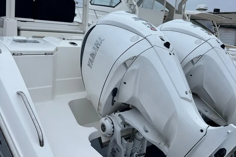 Slide: The Image of 2024 Pursuit S 328 Sport boat with dual Yamaha outboard engines. - 21
