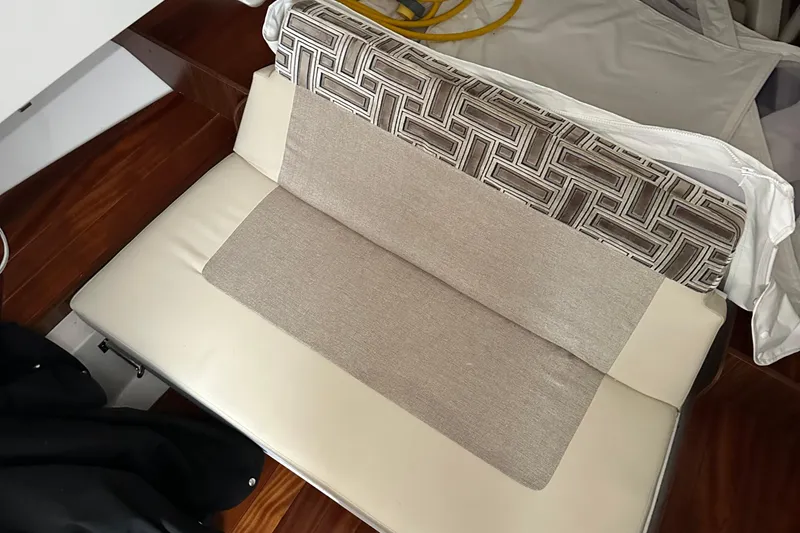 Slide: The Image of 2024 Pursuit S 328 Sport boat interior seating with patterned and beige cushions. - 27