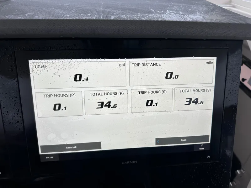 Slide: The Image of 2024 Pursuit S 328 Sport dashboard displaying trip data and fuel usage. - 6