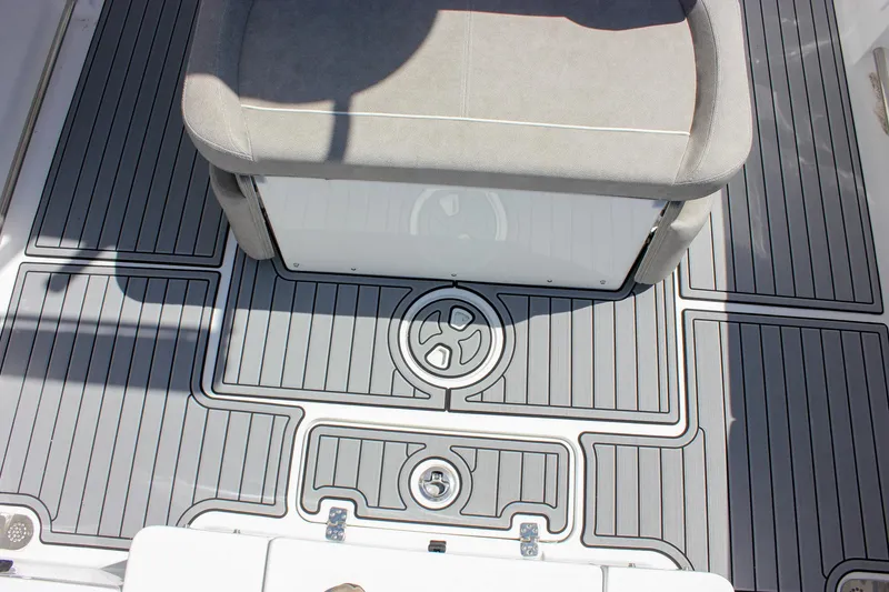 Slide: The Image of 2025 Sea Hunt Ultra 275 SE boat deck with cushioned seating and stylish flooring design. - 14