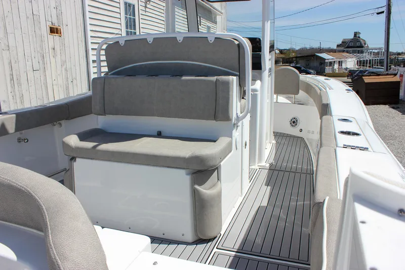 Slide: The Image of 2025 Sea Hunt Ultra 275 SE boat interior with cushioned seating and sleek design. - 16