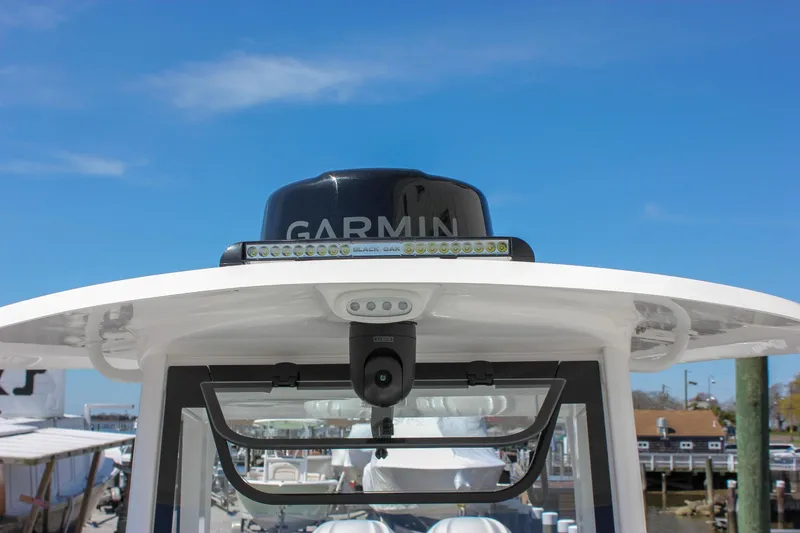 Slide: The Image of 2025 Sea Hunt Ultra 275 SE boat with Garmin radar and clear blue sky background. - 24