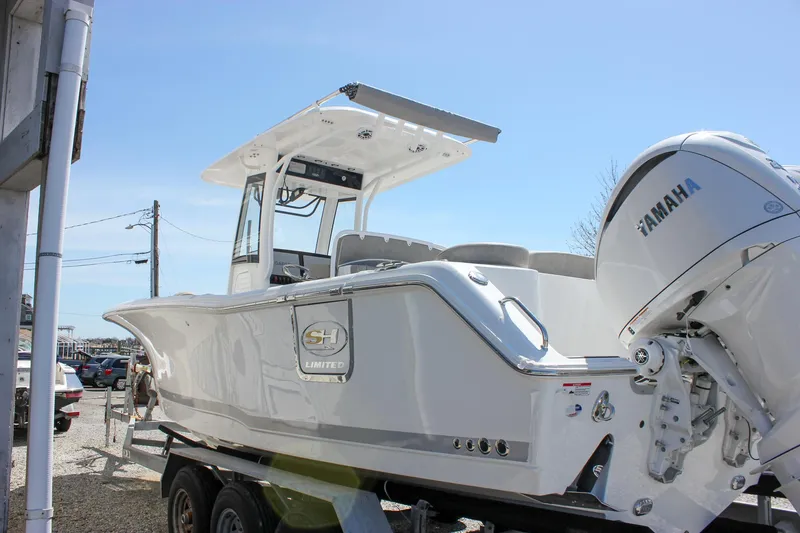 Slide: The Image of 2025 Sea Hunt Ultra 275 SE boat with Yamaha engine on trailer. - 26