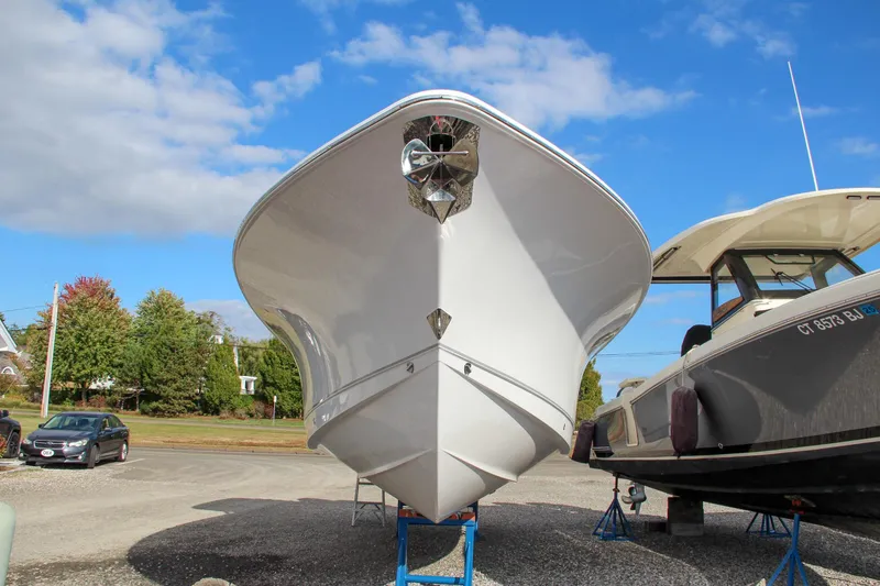 Slide: The Image of 2025 Sea Hunt Ultra 275 SE boat on display, front view, clear sky background. - 27