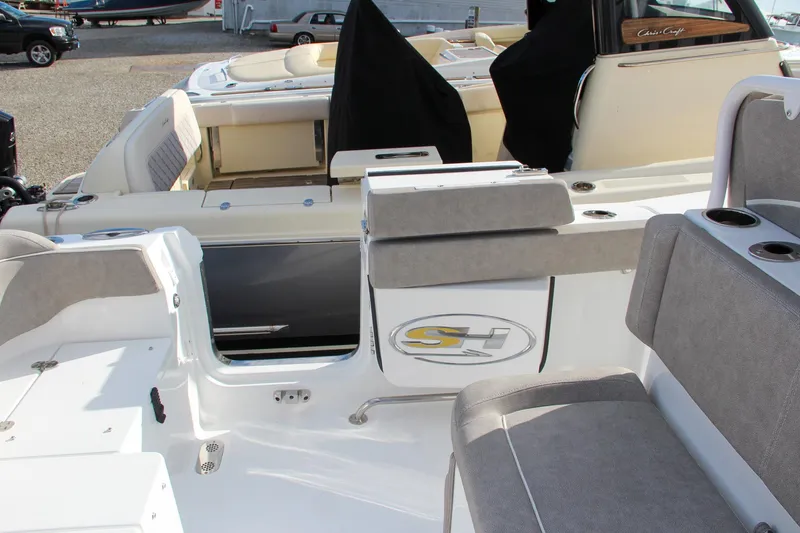 Slide: The Image of 2025 Sea Hunt Ultra 275 SE boat interior with seating and storage compartments. - 32