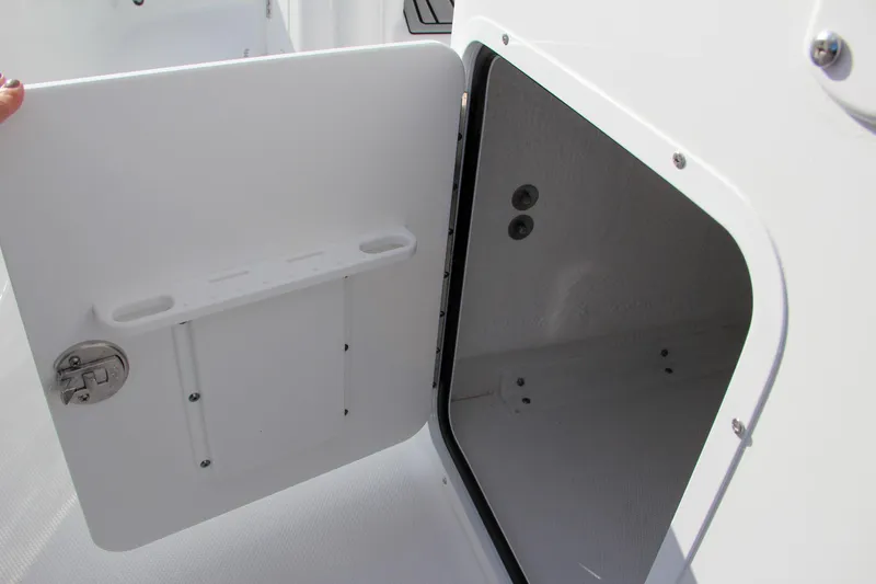 Slide: The Image of Open storage compartment on 2025 Sea Hunt Ultra 275 SE boat. - 33