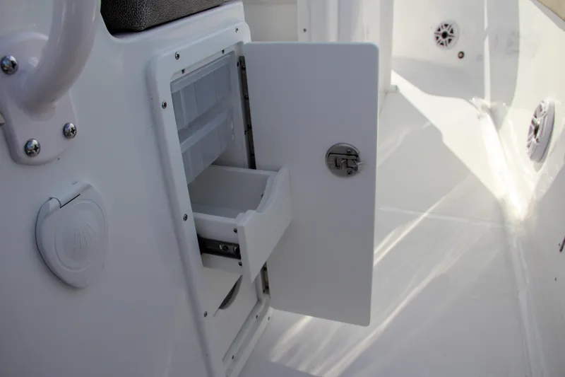 Slide: The Image of Open storage compartment on 2025 Sea Hunt Ultra 275 SE boat interior. - 35