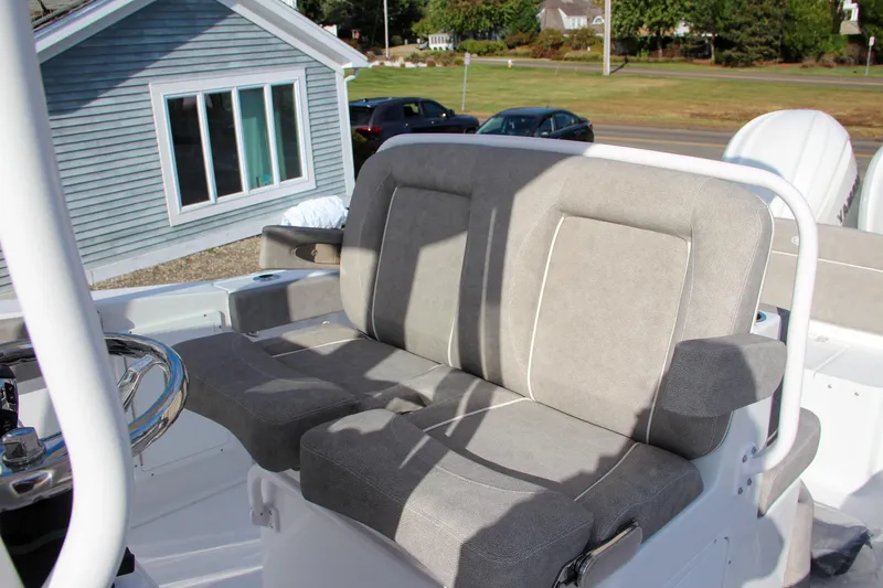 Slide: The Image of 2025 Sea Hunt Ultra 275 SE boat seating with gray cushions, outdoor setting. - 38