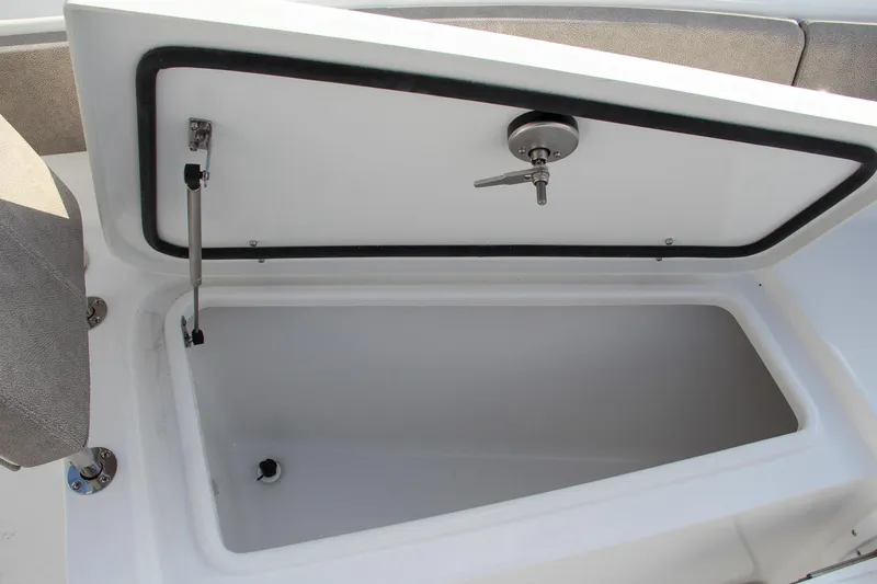 Slide: The Image of Open storage compartment on 2025 Sea Hunt Ultra 275 SE boat. - 43