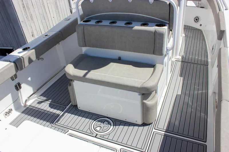 Slide: The Image of 2025 Sea Hunt Ultra 275 SE boat interior with cushioned seating and sleek flooring. - 8