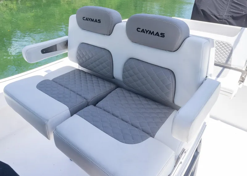 Slide: The Image of 2023 Caymas 28 HB boat seats with gray quilted upholstery and Caymas branding. - 20