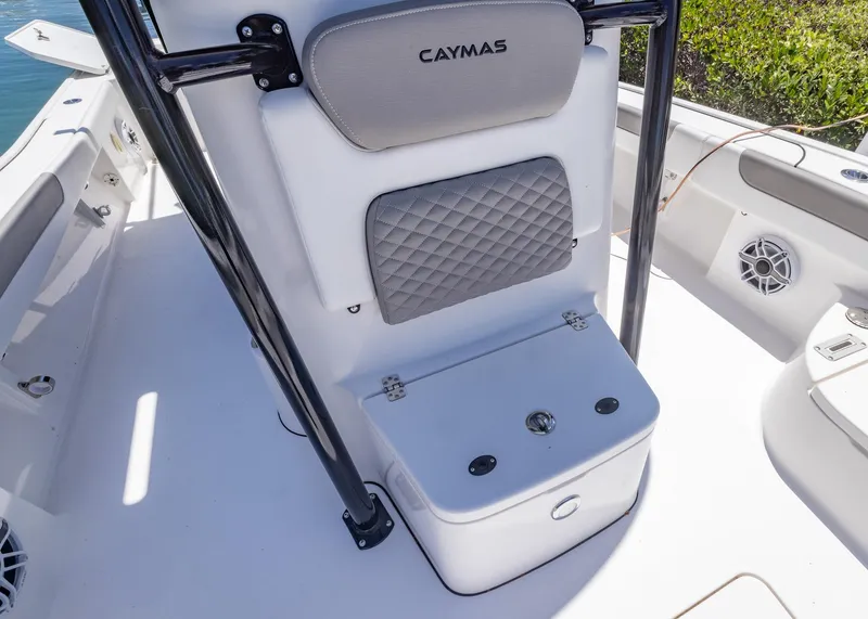 Slide: The Image of 2023 Caymas 28 HB boat interior with cushioned seating and storage. - 8