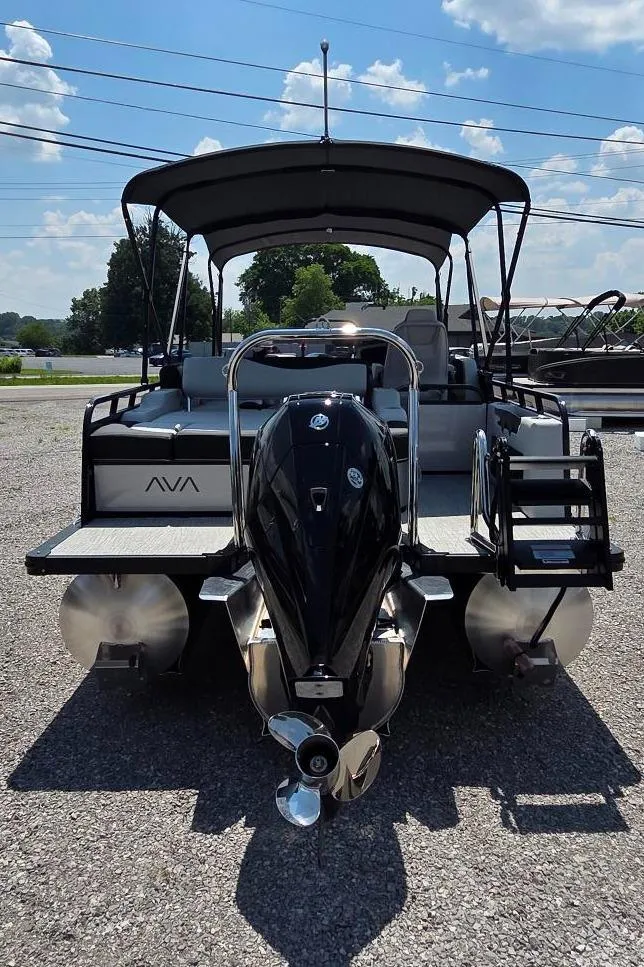 Slide: The Image of 2025 Avalon Platinum LSZ 2585 Versatile Rear Bench pontoon boat, rear view, sunny day. - 4