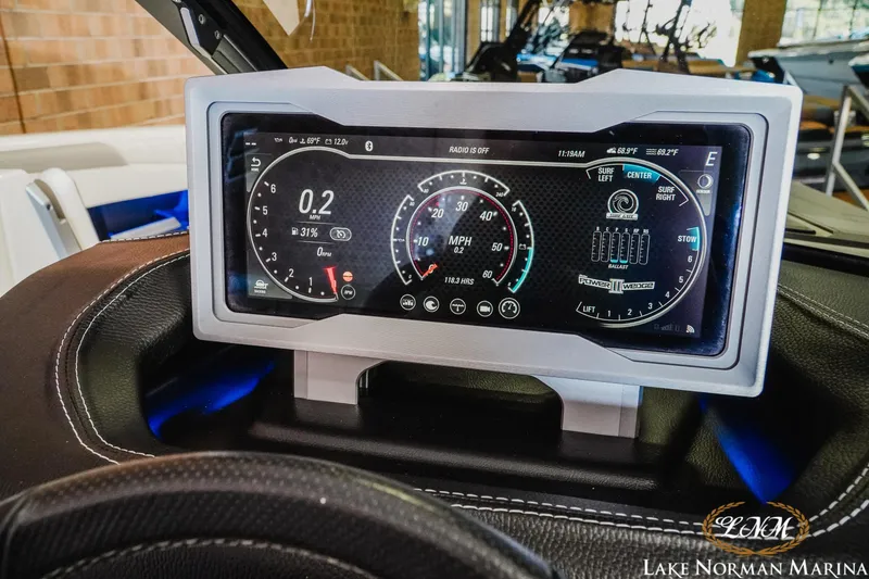 Slide: The Image of Dashboard display of a 2021 Malibu M240 boat at Lake Norman Marina. - 13