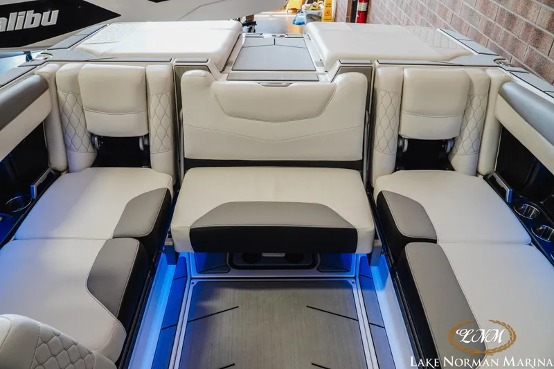 Slide: The Image of Luxurious interior of 2021 Malibu M240 boat with plush seating and ambient lighting. - 21