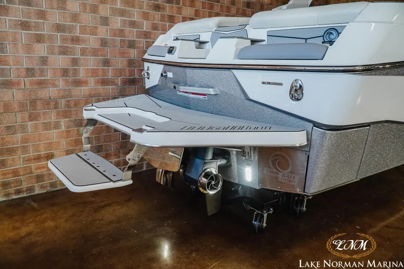 Slide: The Image of 2021 Malibu M240 boat rear view with swim platform at Lake Norman Marina. - 6