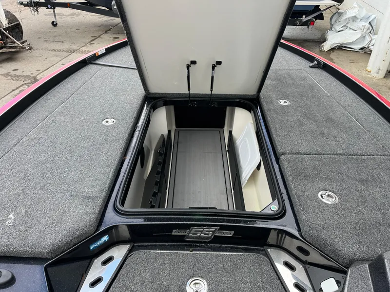 Slide: The Image of 2023 Ranger Z521R boat with open storage compartment, showcasing spacious interior design. - 11