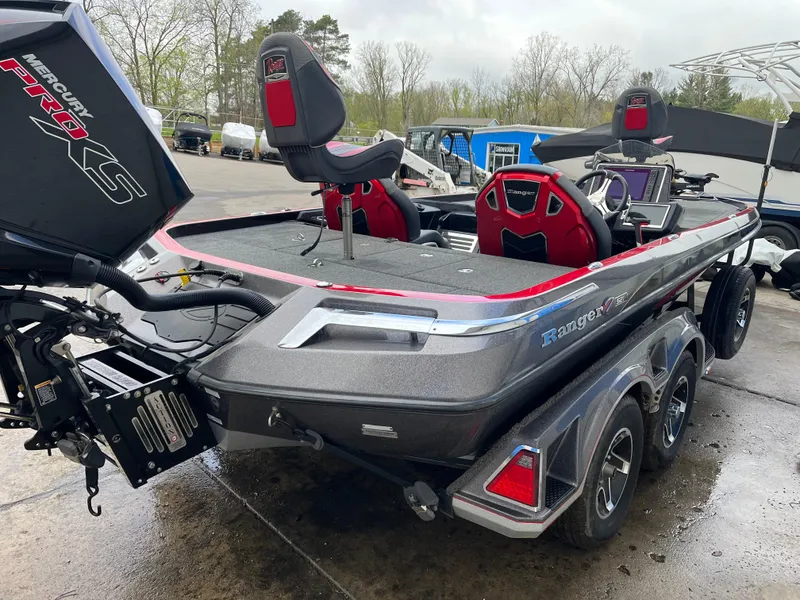 Slide: The Image of 2023 Ranger Z521R bass boat with dual seats and powerful outboard motor. - 4
