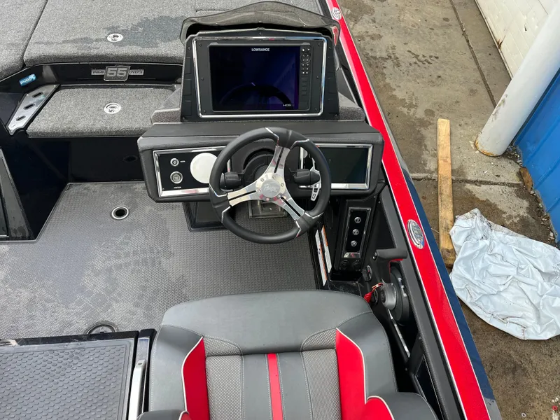 Slide: The Image of 2023 Ranger Z521R boat cockpit with steering wheel and navigation display. - 8