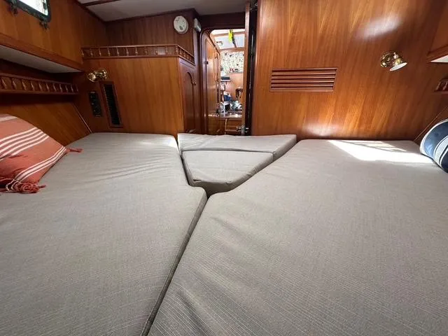 Slide: The Image of 1987 Albin Double Cabin interior with wooden paneling and comfortable bedding. - 25