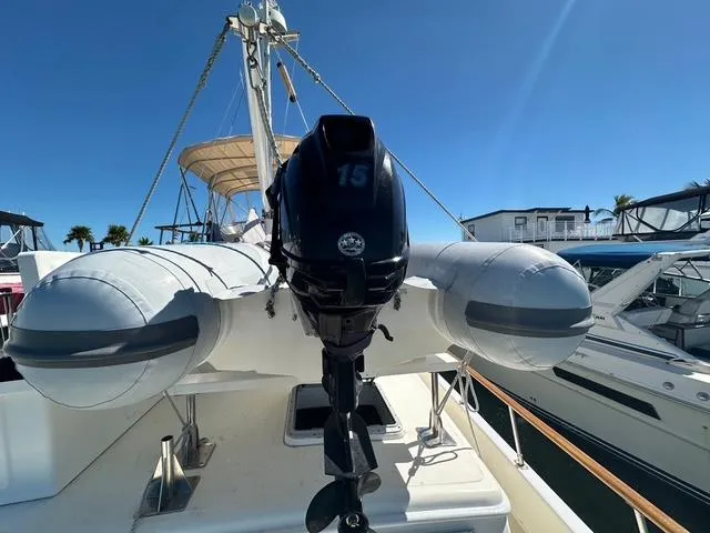 Slide: The Image of 1987 Albin Double Cabin with inflatable boat and outboard motor on deck. - 29