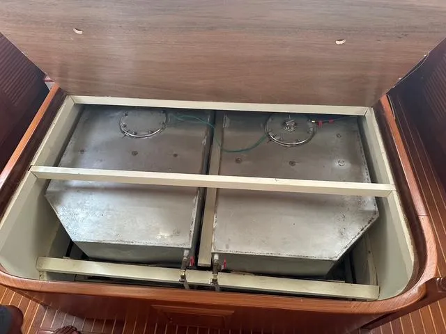 Slide: The Image of Fuel tanks inside 1987 Albin Double Cabin boat, under wooden hatch. - 32