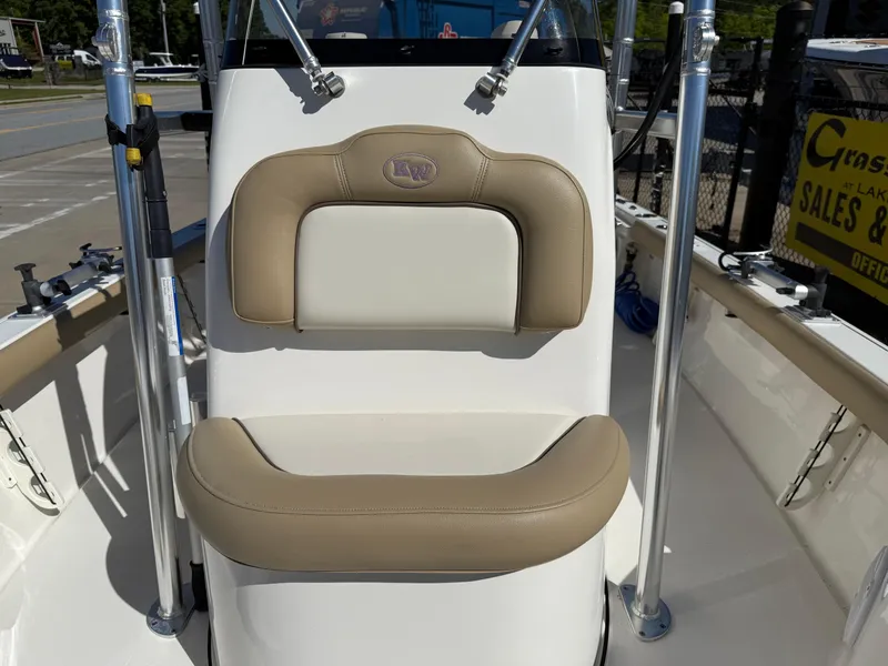 Slide: The Image of 2020 Key West 210 BR boat seat with beige and white upholstery. - 16