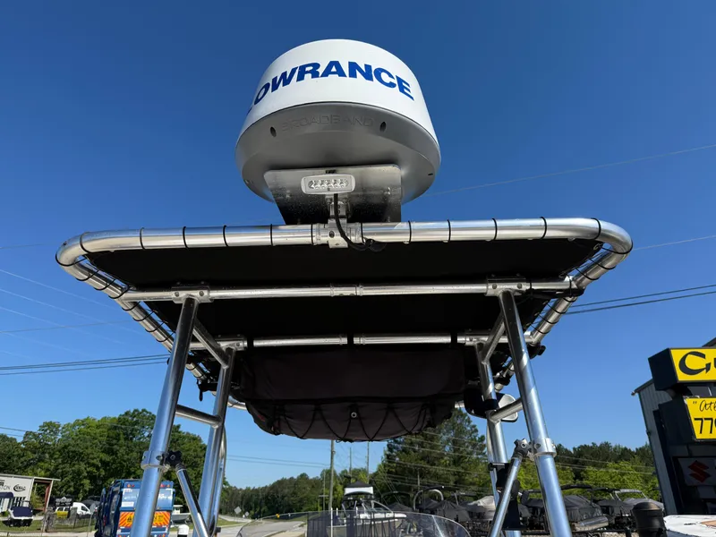 Slide: The Image of 2020 Key West 210 BR boat with Lowrance radar, viewed from below against a clear blue sky. - 17