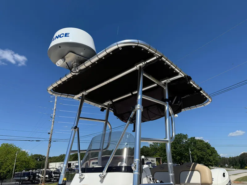 Slide: The Image of 2020 Key West 210 BR boat with radar and T-top under clear blue sky. - 25