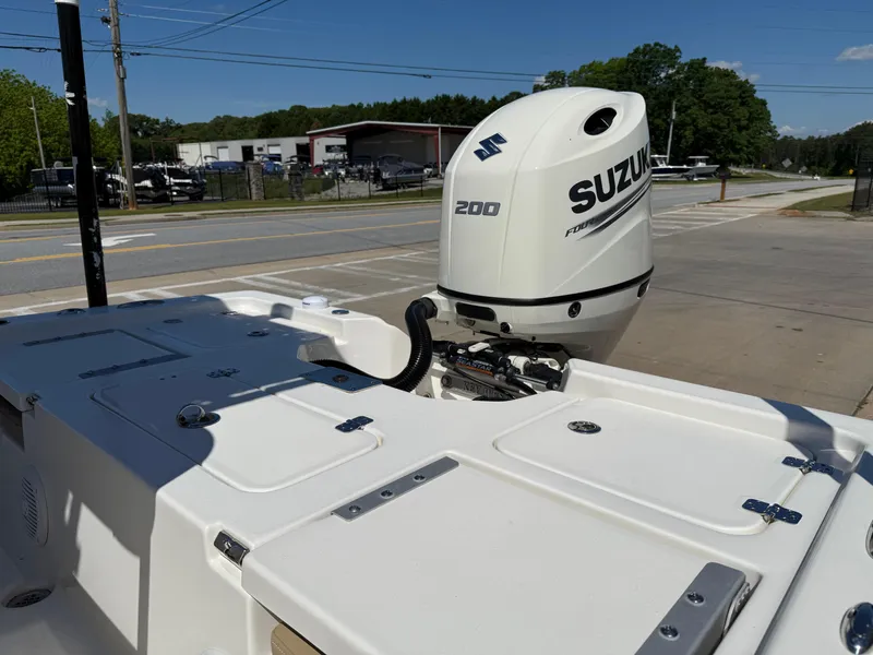Slide: The Image of Key West 210 BR 2020 boat with Suzuki 200 outboard motor in a parking area. - 26