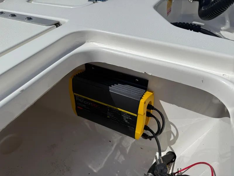 Slide: The Image of Battery charger installed in a 2020 Key West 210 BR boat compartment. - 27