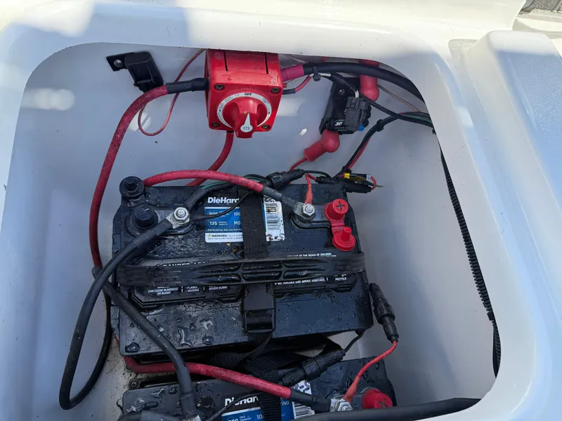 Slide: The Image of Battery compartment of 2020 Key West 210 BR boat with wiring and switch. - 28