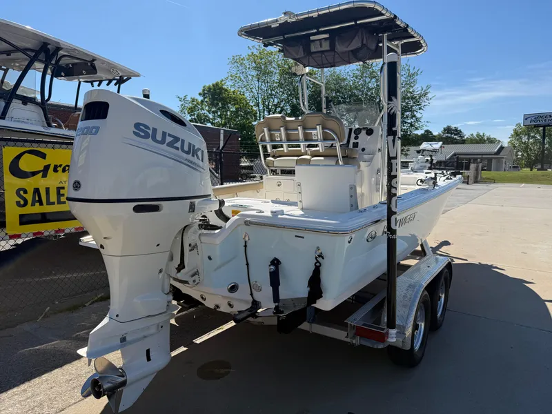 Slide: The Image of 2020 Key West 210 BR boat with Suzuki outboard motor on a trailer. - 6