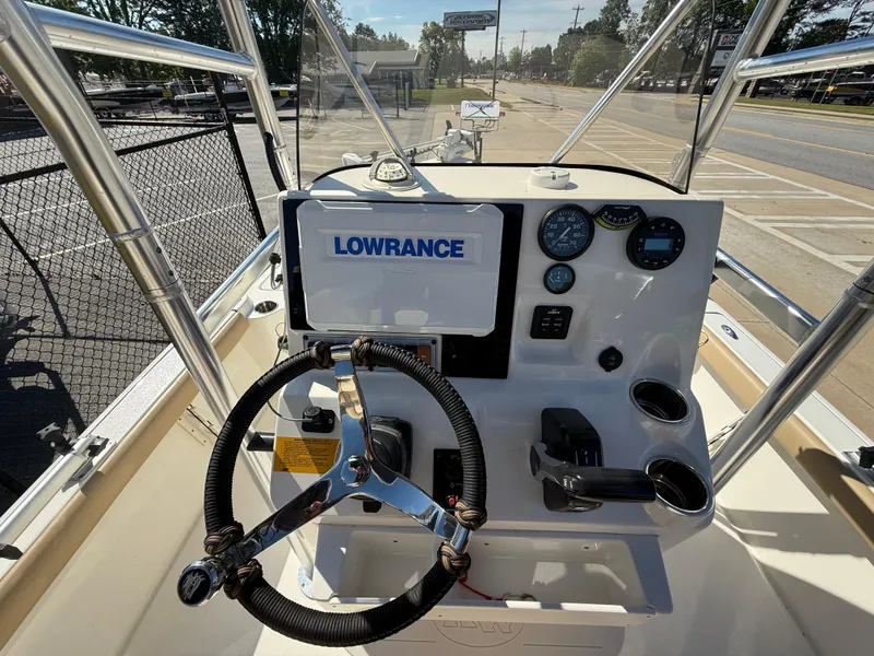 Slide: The Image of 2020 Key West 210 BR boat dashboard with Lowrance display and steering wheel. - 7