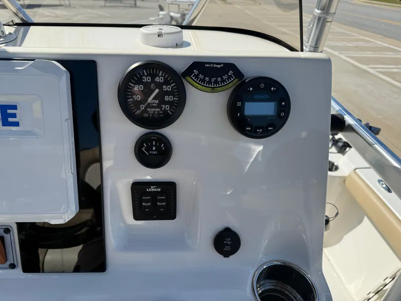 Slide: The Image of Dashboard of a 2020 Key West 210 BR boat with gauges and controls. - 9