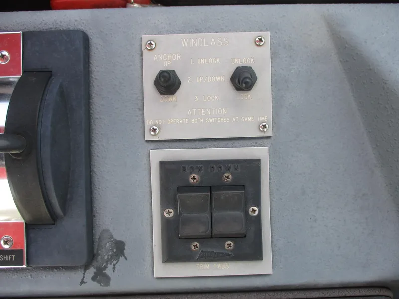 Slide: The Image of Control panel of a 1991 Sea Ray 350 Express Cruiser with windlass switches. - 12