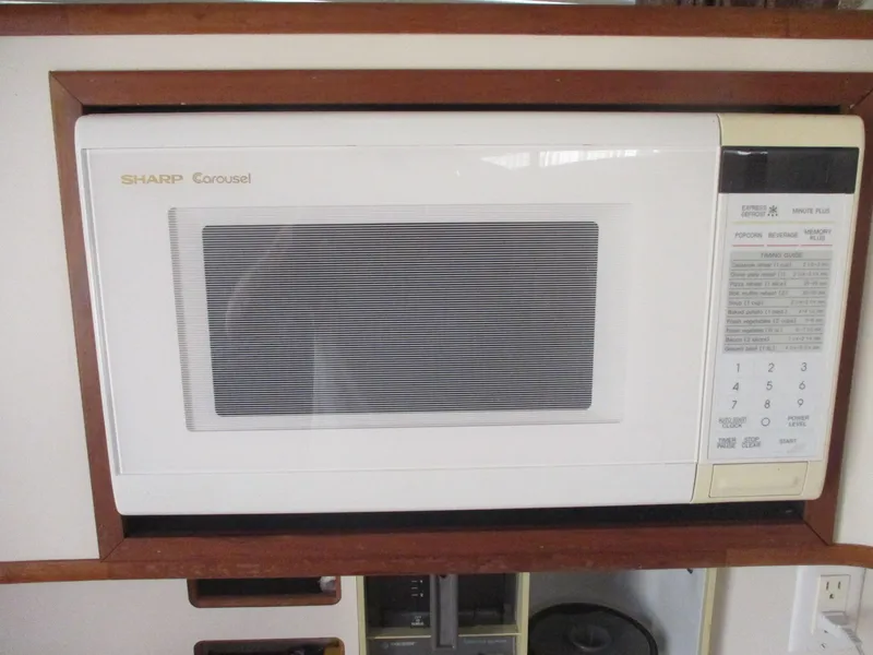 Slide: The Image of Sharp Carousel microwave in a 1991 Sea Ray 350 Express Cruiser kitchen. - 18