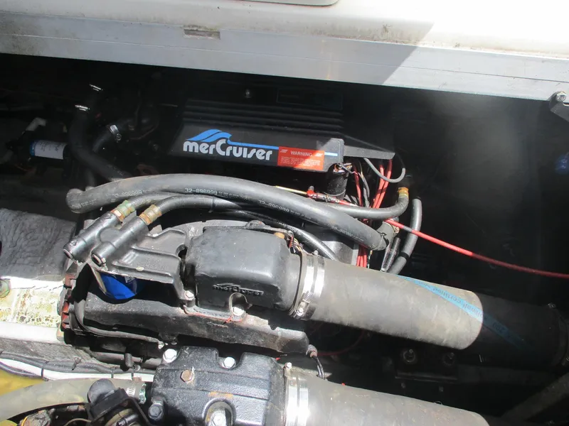 Slide: The Image of Engine compartment of a 1991 Sea Ray 350 Express Cruiser with MerCruiser components. - 31