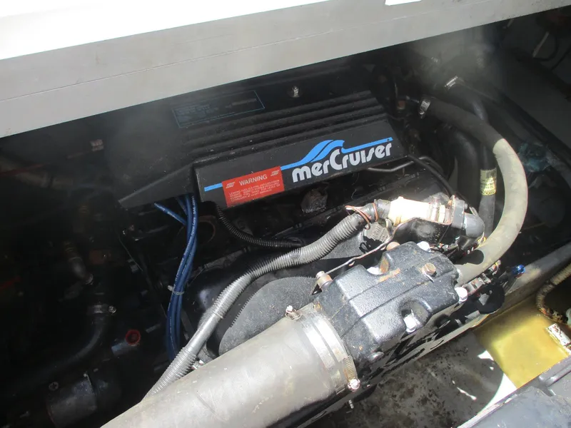 Slide: The Image of Engine compartment of 1991 Sea Ray 350 Express Cruiser with MerCruiser components. - 33