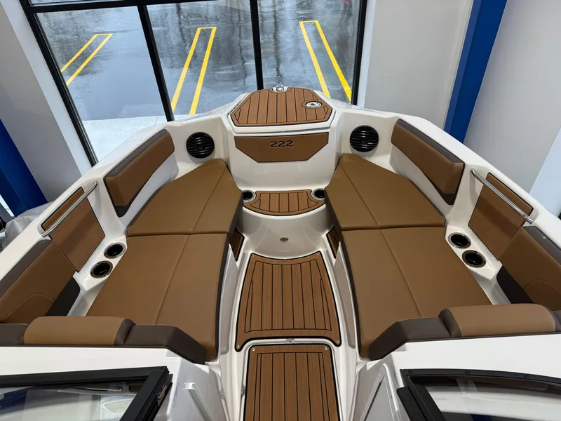 Slide: The Image of 2025 Yamaha Boats 222SD interior with brown seating and sleek design. - 4
