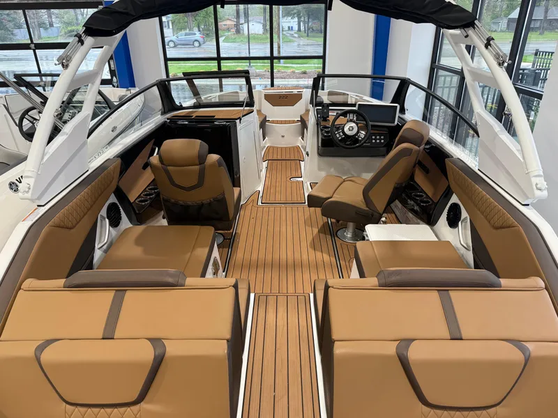 Slide: The Image of 2025 Yamaha Boats 222SD interior with brown seating and modern dashboard design. - 8
