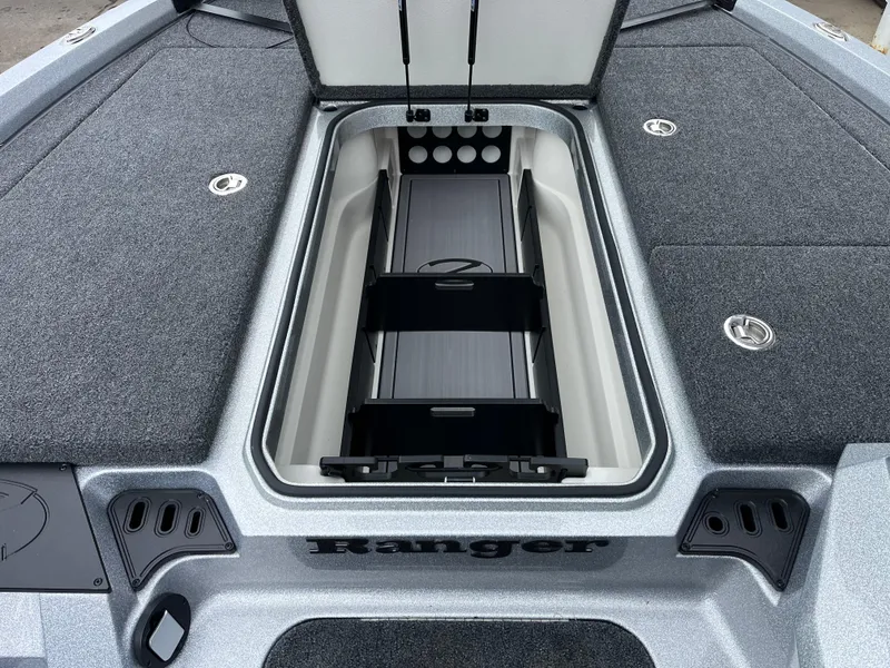Slide: The Image of 2024 Ranger Z518 Garmin Ranger Cup boat storage compartment, open and spacious. - 17
